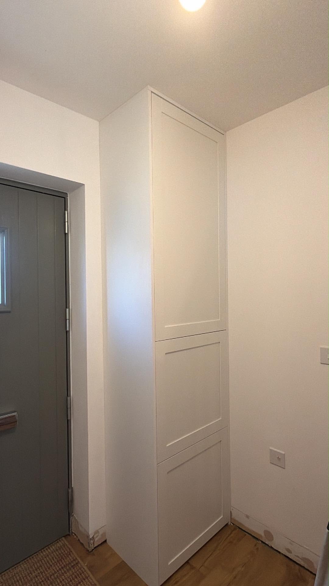 Tall fitted hallway storage made by JWS Carpentry & Joinery