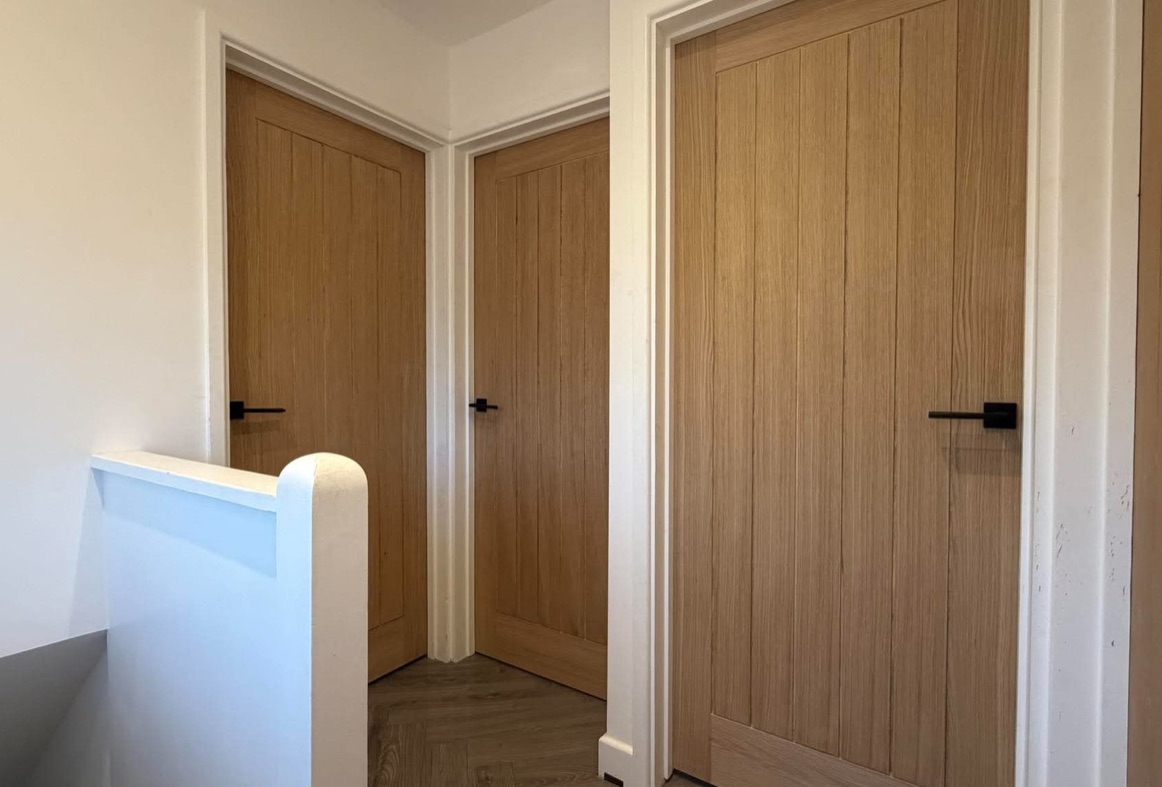 Oak internal doors fitted across a landing